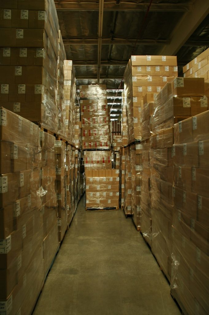 Plastic wrapped boxes, Columbian coffee, warehouse, concrete floor, Los Angeles, California, USA